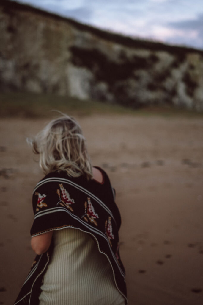 Bump shoot with pregnant mother on the beach for professional pregnancy shoot captured by Naomi Gale