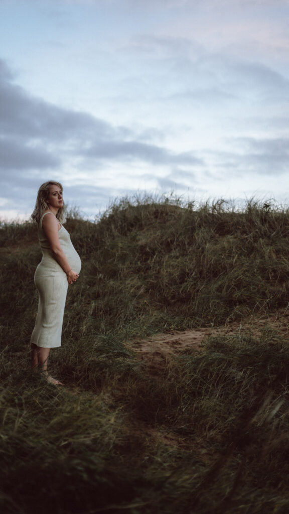 Bump shoot with pregnant mother on the beach for professional pregnancy shoot captured by Naomi Gale