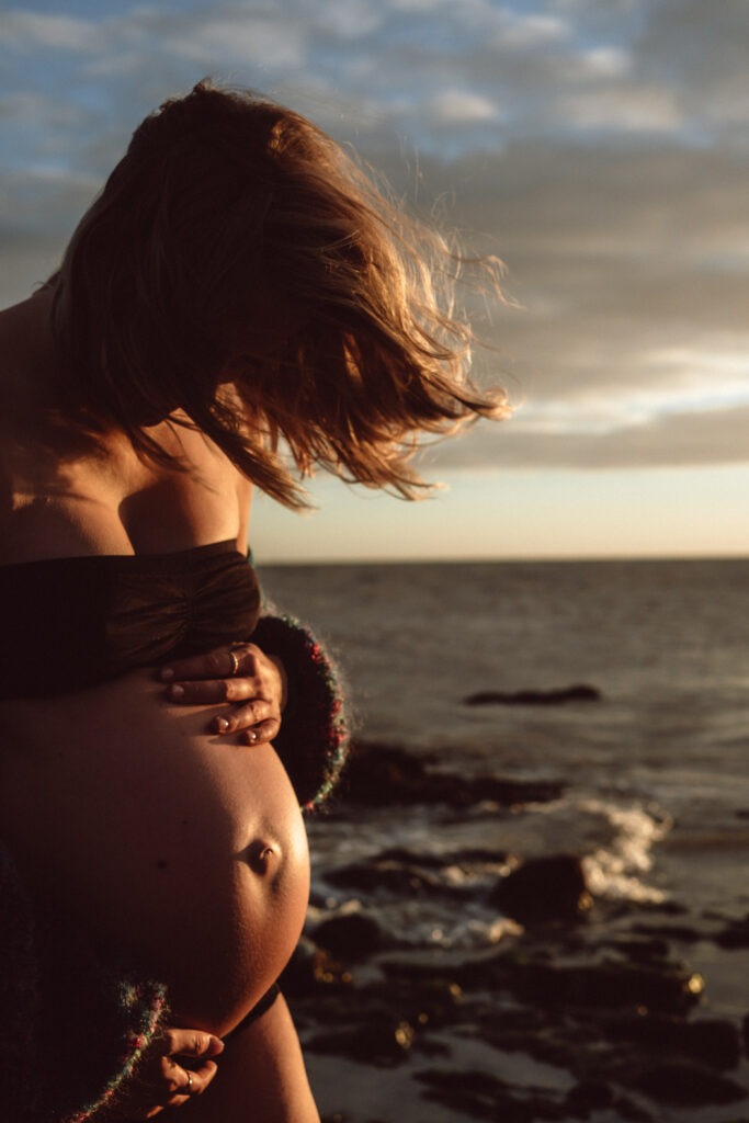 Bump shoot with pregnant mother on the beach for professional pregnancy shoot in Margate at Botany Bay with the sunrise captured by Naomi Gale