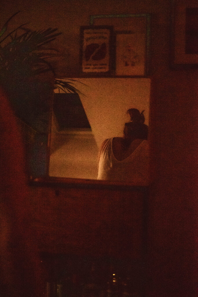 QEQM St Peters Midwife-Led Unit Birth. Margate birth with doula care in her home showing a reflection in a mirror during a contraction before transferring to QEQM