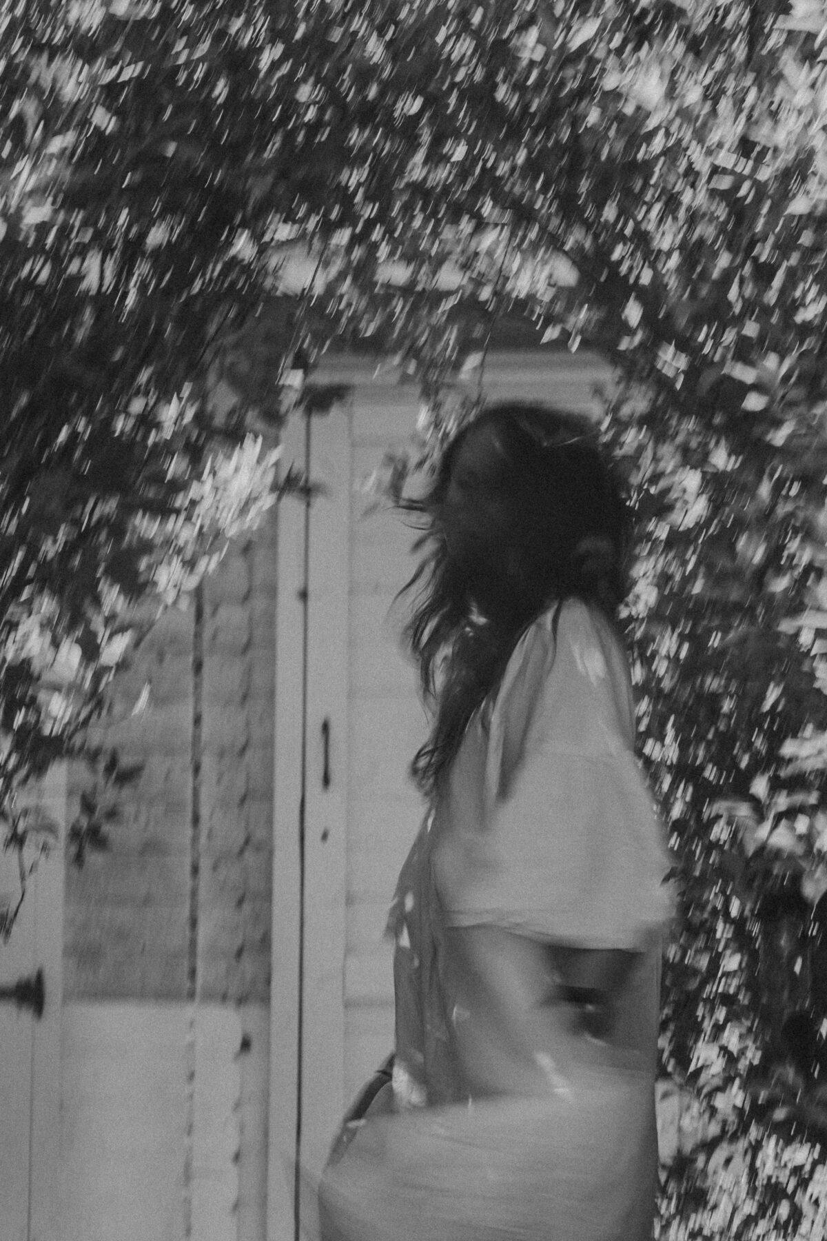 Naomi standing barefoot in grass, connecting with the earth to symbolize rooting into the body and pelvic healing from the holistic pelvic floor healing course.